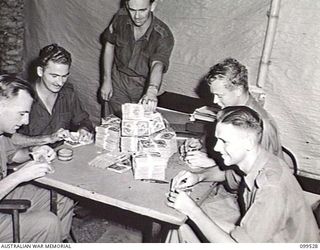 RABAUL, NEW BRITAIN, 1945-12-21. MEMBERS OF THE CASH OFFICE, 11 DIVISION, CHECKING OVER JAPANESE CURRENCY WHILE TAKING OVER JAPANESE FINANCES IN THE RABAUL AREA