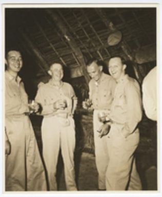 [Captain Carlos W. Wieber and other servicemen drinking beverages]