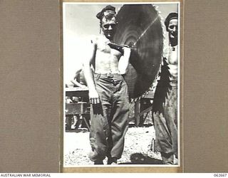 RAMU VALLEY, NEW GUINEA. 1943-12-21. VX118322 SAPPER J. LEBNER (LEFT) AND VX84648 LANCE CORPORAL R. G. PEDDERSEN BOTH OF THE 53RD AUSTRALIAN FIELD PARK COMPANY, ROYAL AUSTRALIAN ENGINEERS, 7TH ..