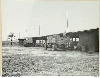 PORT MORESBY, PAPUA, NEW GUINEA, 1944-03-01. PERSONNEL UNLOADING STORES AT THE 4 MILE DETAILS ISSUING DEPOT OF THE 183RD SUPPLY DEPOT PLATOON