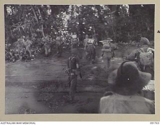 SORAKEN AREA, BOUGAINVILLE, 1945-05-06. C COMPANY, 26 INFANTRY BATTALION, (A.I.F.) LANDING ON THE BEACH AT TOROKORI ISLAND. THE TRIAL LANDING WAS PART OF THE PREPARATION FOR A LANDING AT THE NORTH ..