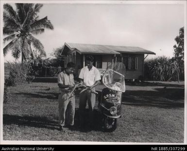 Field Officer and farmer inspecting cane