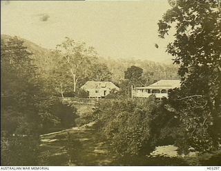 Namanula, New Britain. c. 1915. Government House and the Overseer's House as seen from the residence of the Director of the Rabaul Botanic Gardens. (Donor J.R. Travers)