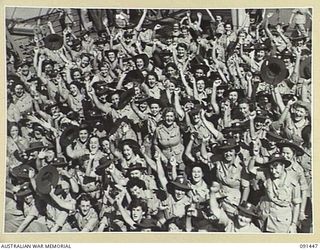 LAE, NEW GUINEA, 1945-05-07. SOME OF THE AUSTRALIAN WOMEN'S ARMY SERVICE WHO ARRIVED IN LAE FROM AUSTRALIA BY THE MV DUNTROON. THEY ARE EN ROUTE TO THE AUSTRALIAN WOMEN'S ARMY SERVICE BARRACKS AT ..