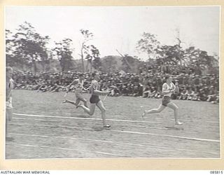 WONDECLA AREA, QLD. 1945-01-19. TEAMS APPROACHING THE FINISH OF THE 880 YARDS RELAY RACE DURING THE 9 DIVISION GYMKHANA AND RACE MEETING HELD AT HERBERTON RACECOURSE. HQ 9 DIVISION PERSONNEL ARE ..