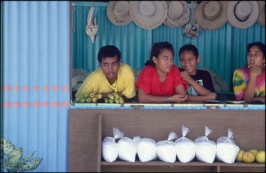 Group of children behind counter