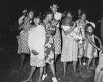 Marquesans at the village of Taiohae perform "Nuku Hiva" dance, with scientific crew from the Capricorn Expedition as audience