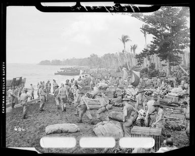 New Zealand troops sorting out equipment on the beach at Guadalcanal, Solomon Islands, during World War II