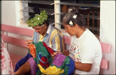 Two women sewing tivaevae