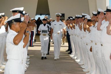 US Navy (USN) CHIEF PETTY Officer's (CPO) assigned to various commands in the Hawaii area, render a salute as the remains of USN CHIEF Machinist's Mate (MMC) Anthony Francis Czarnecki are taken aboard the USS ARIZONA Memorial to be entombed. USN MMC Czarnecki and his brother Stanley were among 36 sets of brothers assigned to ARIZONA during the December 7, 1941 attack on Pearl Harbor. USN MMC Czarnecki's brother was killed in the attack and his last wish was to be returned to USS ARIZONA to be with his brother and shipmates upon his passing