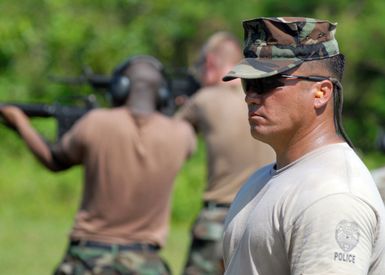 U.S. Navy PETTY Officer 1ST Class Michael Kokkeby, observes Sailors during a Colt 5.56mm M16A2 Assault Rifle qualification at the Naval Base Guam, gun range. Kokkeby is currently the lead range safety officer assigned to Naval Security Detachment at the Guam based Armory. (U.S. Navy PHOTO by Mass Communication SPECIALIST 2nd Class John F. Looney) (Released)