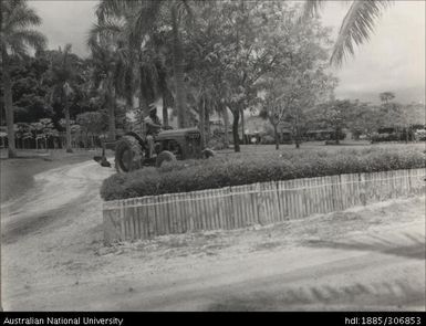 Farmer riding tractor