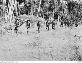 MADANG, NEW GUINEA. 1944-04-26. A PATROL OF C COMPANY, 57/60TH INFANTRY BATTALION MOVING THROUGH JUNGLE ON THE COAST AT ERIMA. THE PATROL WAS THE FIRST TO ENTER MADANG. IDENTIFIED PERSONNEL ARE:- ..