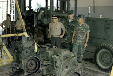LGEN Choi Ki Duk, second vice chief of naval operations, Korea, reviews the Motor Transport Center during a visit