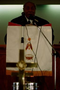 King Taufa'ahau Tupou IV speaking from the pulpit at the dedication of Vaine Mo'onia (The True Vine) church