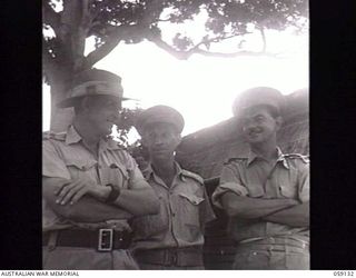 KILA, NEW GUINEA. 1943-10-24. OFFICERS OF THE AUSTRALIAN AND NEW GUINEA ADMINISTRATIVE UNIT AT THE NATIVE LABOUR CAMP. LEFT TO RIGHT: PX121 LIEUTENANT (LT) G. J. WILLS, ASSISTANT DIRECTOR OF NATIVE ..