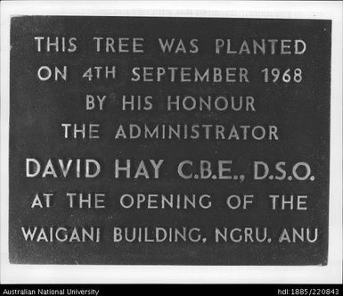 Plaque placed at the base of a tree at the Waigani Building