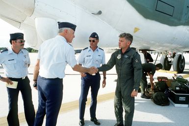 COL Meyers, commander of the 43rd Strategic Wing, greets LTC Kenneth J. Hacker, commander of the 37th Bomb Squadron. LTC Hacker arrived at the base aboard a B-52H Stratofortress aircraft to participate in Exercise Glad Customer '82