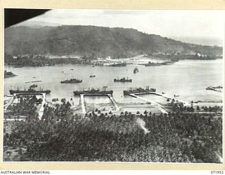 LANGEMAK BAY, NEW GUINEA. 1944-04-03. AN AERIAL PHOTOGRAPH INDICATING THE PORT DEVELOPMENT AND THE INCREASED MOVEMENT OF SUPPLIES THROUGH THE AREA