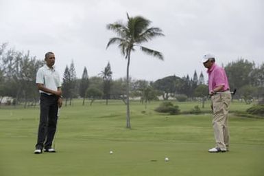 Barack Obama plays golf with Prime Minister Najib Razak, Joe Paulsen, and Mike Brush in Kaneohe Bay, Hawaii, December 24, 2014