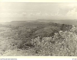 FINSCHHAFEN AREA, NEW GUINEA, 1944-03-17. VIEWED SOUTH SOUTH EAST FROM FOUGASSE CORNER, PICTURING SISI VILLAGE TO THE LEFT, KUMAWA, AND FINSCHHAFEN TO THE RIGHT IN THE BACKGROUND