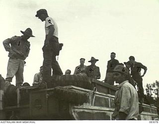 BABIANG, NEW GUINEA. 1944-11-06. AUSTRALIAN PERSONNEL BOUND FOR HQ 2/10 COMMANDO SQUADRON ABOARD AN AMPHIBIOUS DUKW. IDENTIFIED PERSONNEL ARE:- FLYING OFFICER CHRISTIANSON, 100 SQN RAAF (1); ..