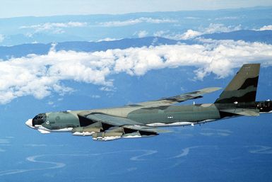 A left side view of a B-52H Stratofortress aircraft in flight from Guam to Darwin Royal Australian Air Force Base, Australia. The aircraft, assigned to the 37th Bomb Squadron, is participating in Exercise Glad Customer '82