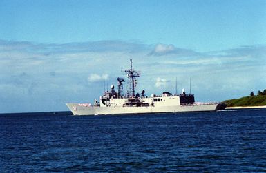 A port quarter view of the guided missile frigate USS CROMMELIN (FFG-37) departing Pearl Harbor