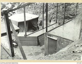 PORT MORESBY, NEW GUINEA. 1944-04-15. MAGAZINES AND GUN TURRET AT THE TWIN 6 POUNDER GUN PIT, GEMO SECTION, CONSTRUCTED BY THE 8TH ARMY TROOPS COMPANY, ROYAL AUSTRALIAN ENGINEERS, USING MATERIAL ..