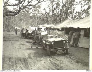 KILIGIA, NEW GUINEA. 1944-04-10. LOADED JEEPS OUTSIDE THE CANTEEN ISSUING POINT 27E OPERATED BY THE AUSTRALIAN ARMY CANTEENS SERVICE