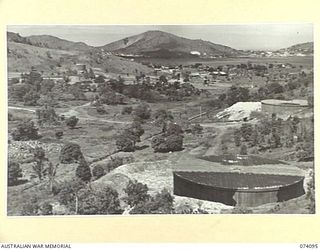 PORT MORESBY, NEW GUINEA. 1944-06-27. NO. 2 SORTING AREA OF THE 1ST BULK PETROLEUM STORAGE COMPANY, SHOWING THE NAVAL BULK STORAGE TANKS NO'S 1 AND 2 (CAPACITY 1,250,000 GALLONS EACH) ON THE RIGHT