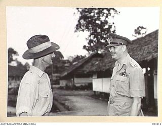 LAE AREA, NEW GUINEA, 1945-06-28. HIS ROYAL HIGHNESS, THE DUKE OF GLOUCESTER, GOVERNOR-GENERAL OF AUSTRALIA (2) SPEAKING WITH WO 1 H. HANDLEY (1), DURING HIS VISIT TO 112 CONVALESCENT DEPOT. WO 1 ..