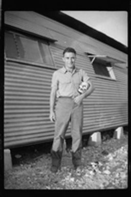 [Elmer A. Ball holding human skull]