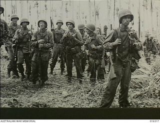 New Britain. December 1943. A group of American forces return to their advance base at Arawe after completing a patrol of the area captured recently from the Japanese. Despite their experiences the ..