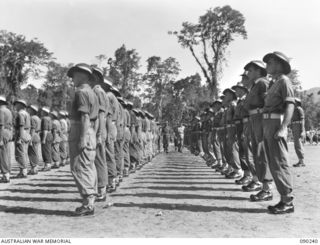 BOUGAINVILLE. 1945-04-04. COLONEL A.L. DAWKINS, DEPUTY DIRECTOR OF MEDICAL SERVICES 2 CORPS (2), ACCOMPANIED BY COLONEL F.K. WALLACE AND LIEUTENANT COLONEL S.D. MEARES (1), INSPECTING 7 FIELD ..