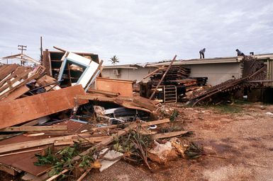 Destroyed buildings display the effects of Typhoon Omar, which struck on August 29th, causing severe damage to Andersen; Naval Station, Guam; and the surrounding area