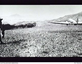 A Douglas Dakota C47 aircraft of the United States Air Force taking off from the airstrip at Bena Bena in the Mount Hagen area. The aircraft has just brought in several members of M Special Unit, ..