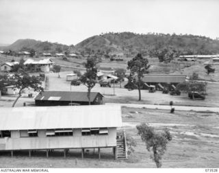 PORT MORESBY, NEW GUINEA. 1944-05-31. THE NEW GUINEA DETAILS DEPOT, LOCATED ON THE SITE OF THE OLD MURRAY BARRACKS AREA. THE TALL WHITE BUILDING (TOP LEFT), WAS THE OPERATING THEATRE OF THE FIRST ..