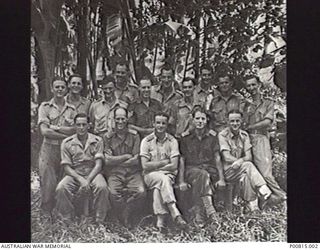 LAE, NEW GUINEA, 1944. GROUP PHOTOGRAPH. INTELLIGENCE SECTION, HEADQUARTERS, NEW GUINEA FORCE. LEFT TO RIGHT: BACK ROW: UNIDENTIFIED, ARTHUR PITTS, JOHN FERGUSON; MIDDLE ROW: UNKNOWN, UNKNOWN, ..