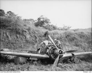 NEW BRITAIN, 1945-09. REMAINS OF A JAPANESE MITSUBISHI A6M ZERO FIGHTER AIRCRAFT, CODED -181, IN THE RABAUL/GAZELLE PENINSULA AREA. (RNZAF OFFICIAL PHOTOGRAPH.)