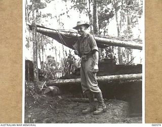 SATTELBERG AREA, NEW GUINEA. 1943-11-15. QX6408 LIEUTENANT COLONEL A. B. GILLESPIE, COMMANDING OFFICER, 2/24TH AUSTRALIAN INFANTRY BATTALION, OUTSIDE THE UNIT INTELLIGENCE OFFICE