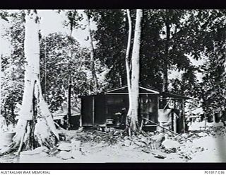 Goodenough Island, D'Entrecasteaux Islands, Papua, 1944. The hut occupied by the Photography Section at the Headquarters of No. 71 Wing RAAF. The sign on the tree at left reads: "Photographic ..