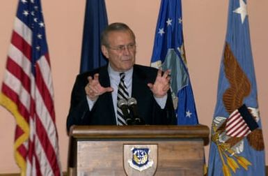 U.S. Secretary of Defense The Honorable Donald H. Rumsfeld, speaks to troops at the Magellan Inn Dining facility during his visit to Andersen Air Force Base, Guam, Nov. 14, 2003. Troops from all military services were in attendance for the speech. (DoD photo by SENIOR AIRMAN Joshua Strang) (Released)