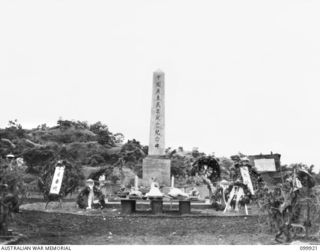 RABAUL, NEW BRITAIN, 1946-03-16. OF THE 653 CHINESE WHO DIED WHILST CAPTIVES OF THE JAPANESE, 259 WERE RE-INTERRED IN A CHINESE CEMETERY AT RABAUL. THE NEAT GROUNDS, ROWS OF MARKED GRAVES AND AN ..