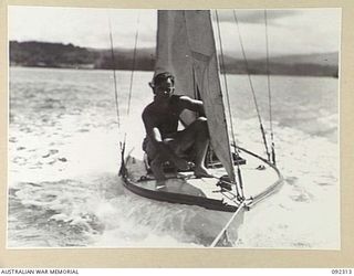 JACQUINOT BAY, NEW BRITAIN, 1945-05-20. THE "LORELEI", A SAILING SKIFF OWNED AND SAILED BY PRIVATE A.D. CAMPBELL, 1 INFANTRY TROOPS WORKSHOP, BEING TOWED TO THE START LINE FOR THE FIRST RACE OF THE ..