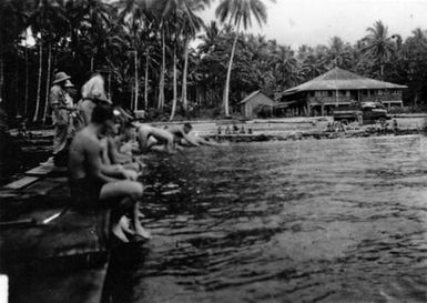 Men swimming and diving