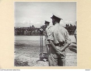 CAPE WOM, NEW GUINEA, 1945-09-13. MAJOR-GENERAL H.C.H. ROBERTSON, GENERAL OFFICER COMMANDING 6 DIVISION, ADDRESSING TROOPS OF 6 DIVISION, DURING THE SURRENDER CEREMONY HELD AT CAPE WOM AIRSTRIP. ..