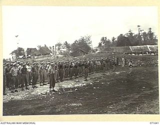HELDSBACH MISSION, FINSCHHAFEN, NEW GUINEA. 1944-03-27. MEMBERS OF THE 2/3RD CASUALTY CLEARING STATION, ON PARADE. (JOINS WITH PHOTOGRAPH NO 071640). IDENTIFIED PERSONNEL ARE: VX15745 CAPTAIN W. ..