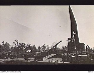 LAE, NEW GUINEA. 1943-10-12. MOBILE FLOATING WHARF, WITH A 50 TON CRANE MOUNTED, ANCHORED AT THE HARBOUR FORESHORE