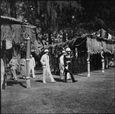 Governor General walking past covered viewing area, Rabaul, New Guinea, 1937 / Sarah Chinnery
